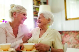 memory-care-mother-and-daughter-smiling-scaled Memory Care. mother and daughter smiling together.