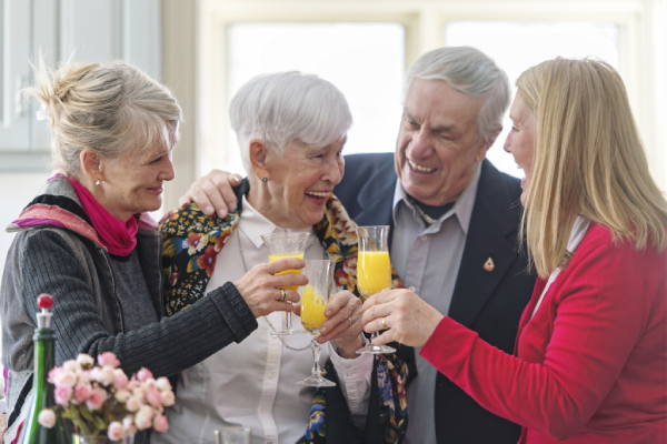 Seniors toast to their day at a senior community.